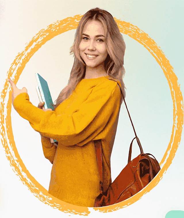 Smiling student holding a notebook